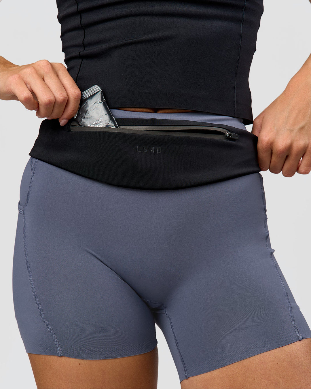 Woman wearing Pace Run Belt - Black-Reflective
