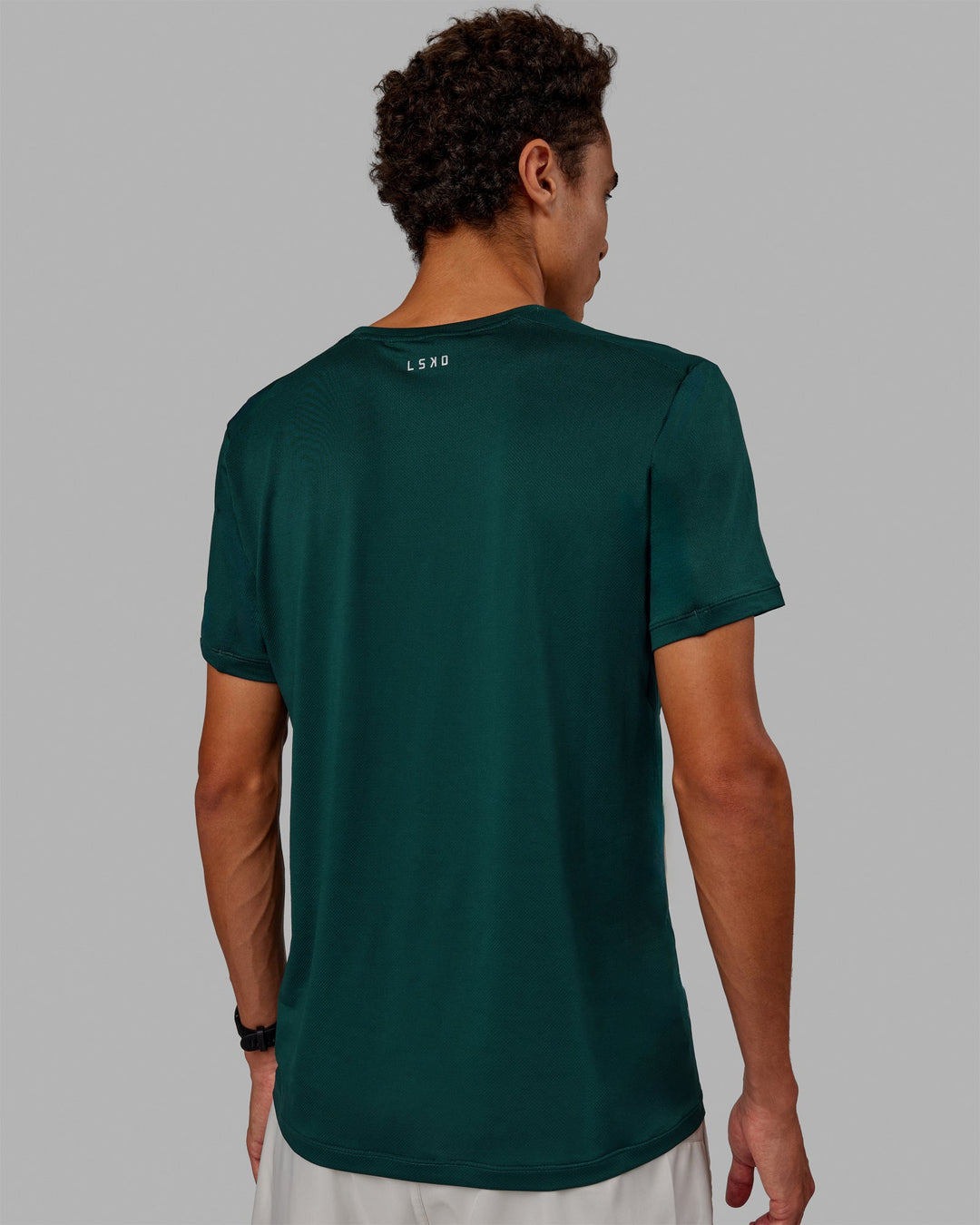 Man wearing Pace Running Tee - Dark Moss