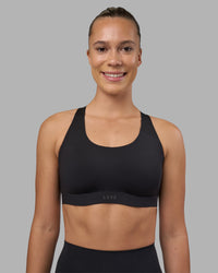 Woman wearing Stability Sports Bra - Black | Model:Charlize | Size:S (A-C Cup) | Thumbnail Index: 2
