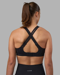 Woman wearing Stability Sports Bra - Black | Model:Charlize | Size:S (A-C Cup) | Thumbnail Index: 3