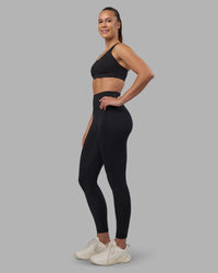 Woman wearing Stability Sports Bra - Black | Model:Charlize | Size:S (A-C Cup) | Thumbnail Index: 9