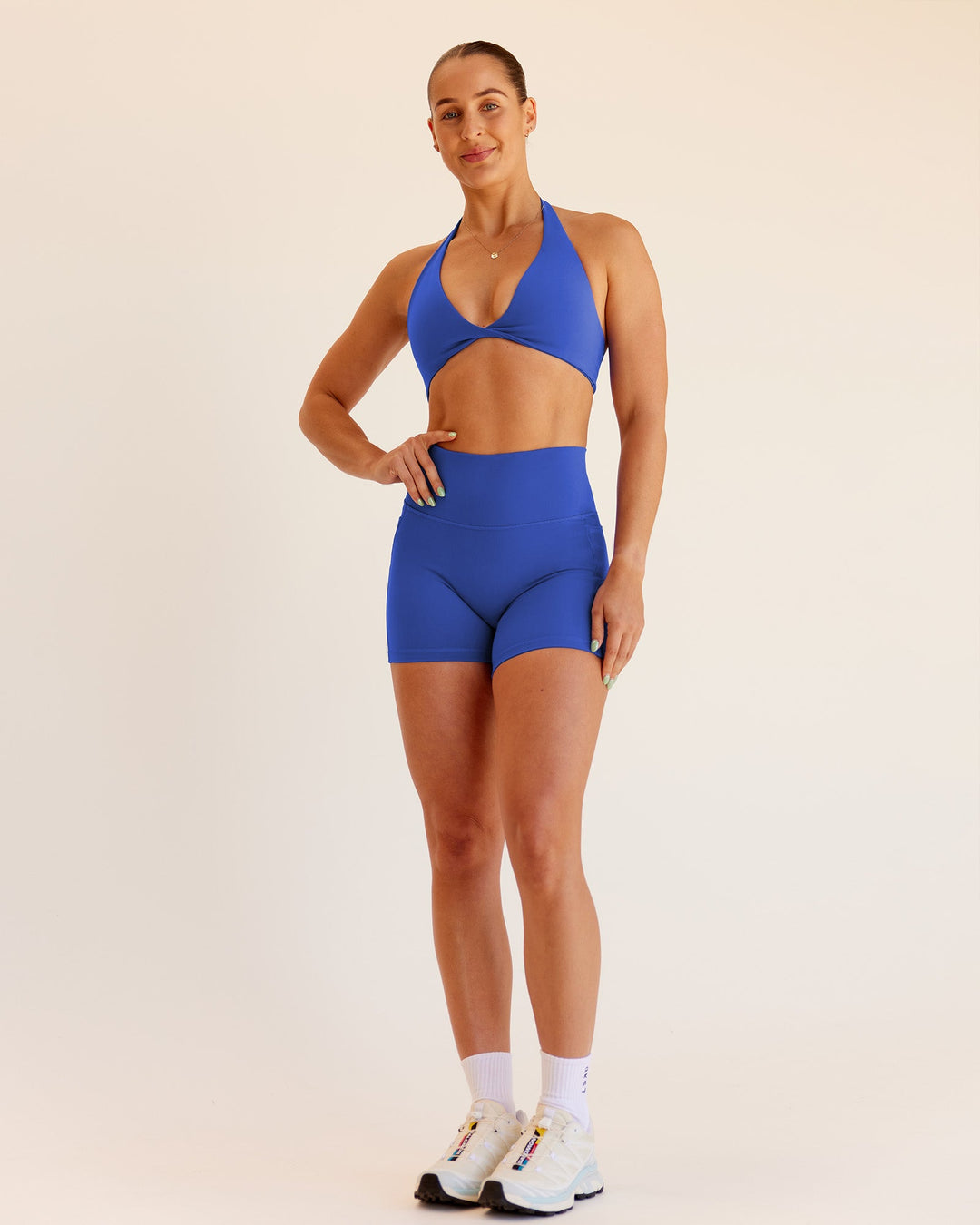 Woman wearing Abs Fusion High-Rise 4&quot; Short Pockets - Power Cobalt | Model:Abbey | Size:S