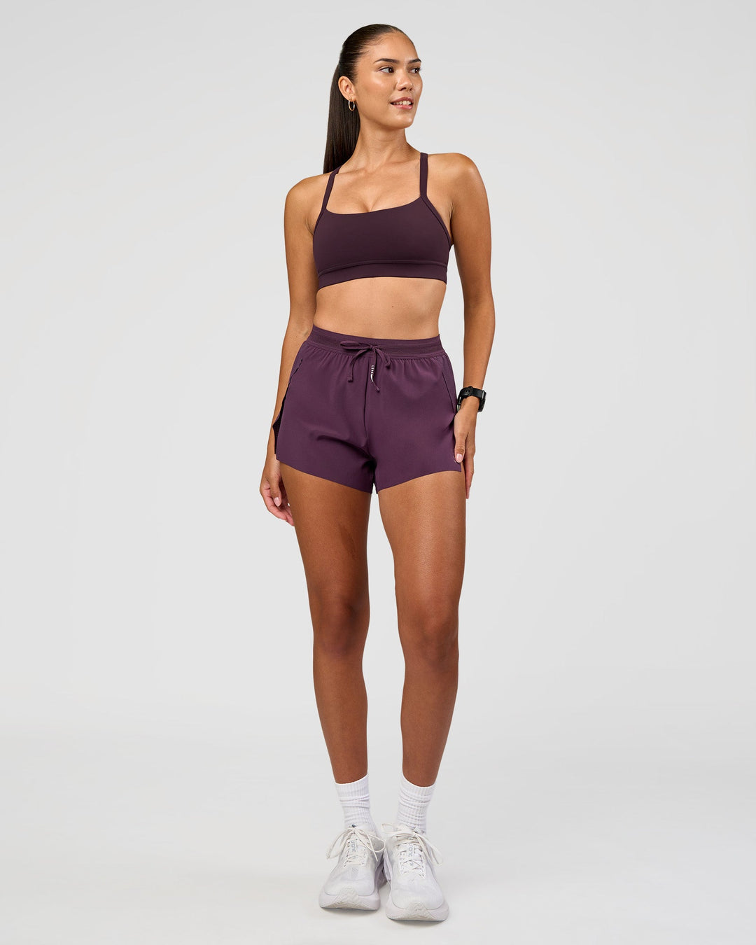 Woman wearing Accelerate 3" High-Rise Running Short - Midnight Plum | Model:Rhiley | Size:S