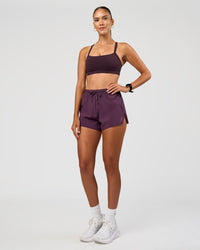 Woman wearing Accelerate 3" High-Rise Running Short - Midnight Plum | Model:Rhiley | Size:S