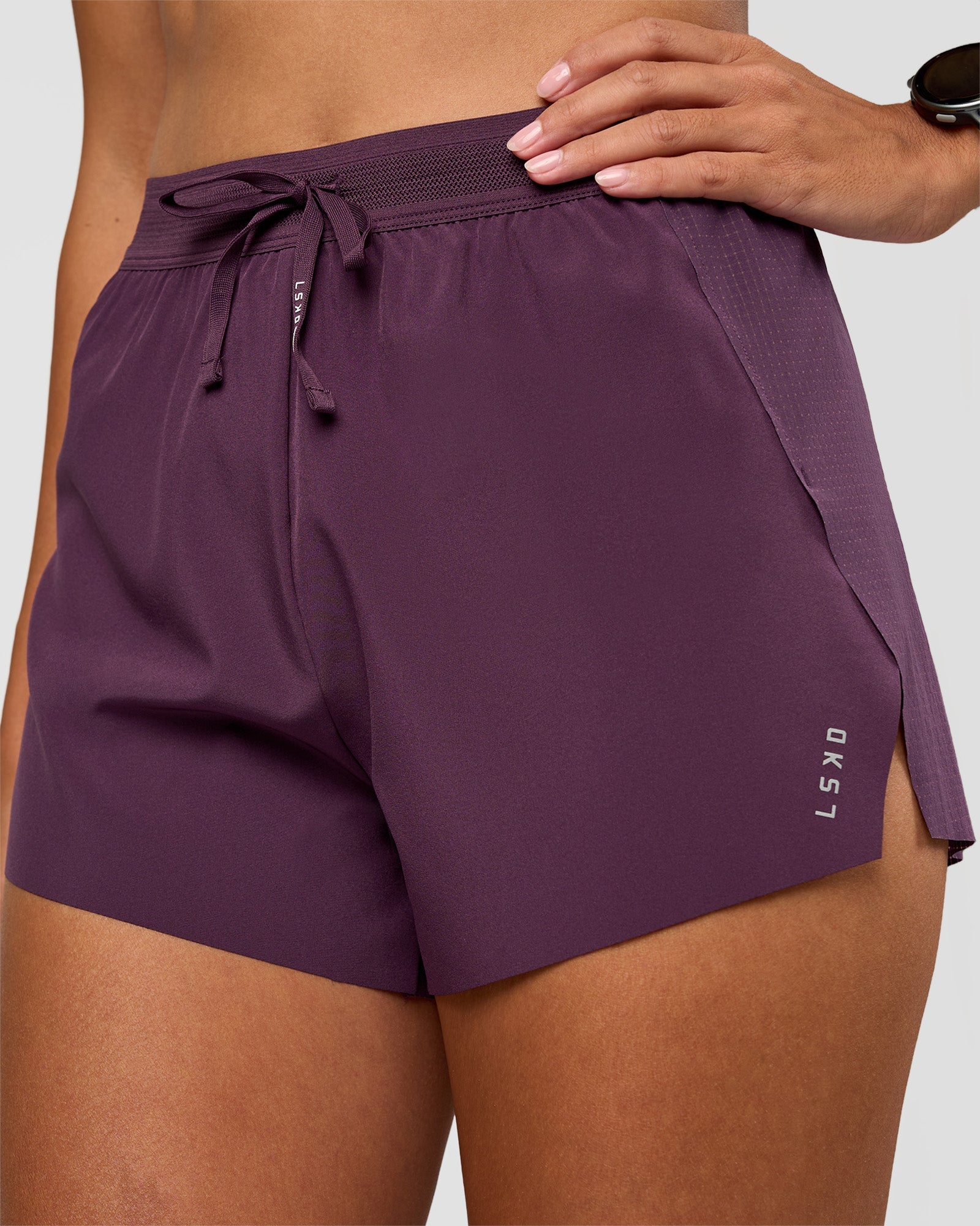 Woman wearing Accelerate 3" High-Rise Running Short - Midnight Plum | Set:true | Angle:closeup | Model:Rhiley | Size:S