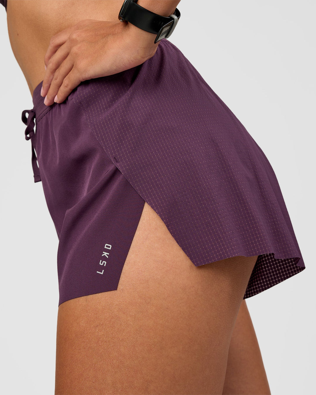 Woman wearing Accelerate 3" High-Rise Running Short - Midnight Plum | Model:Rhiley | Size:S