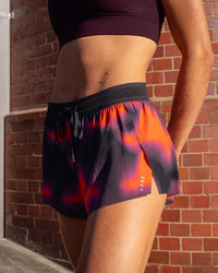 Woman wearing Accelerate 3" Running Short - Inferno Print | Model:Leah | Size:S