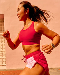 Woman wearing Accelerate Sports Bra - Scarlet | Model:Clare | Size:S