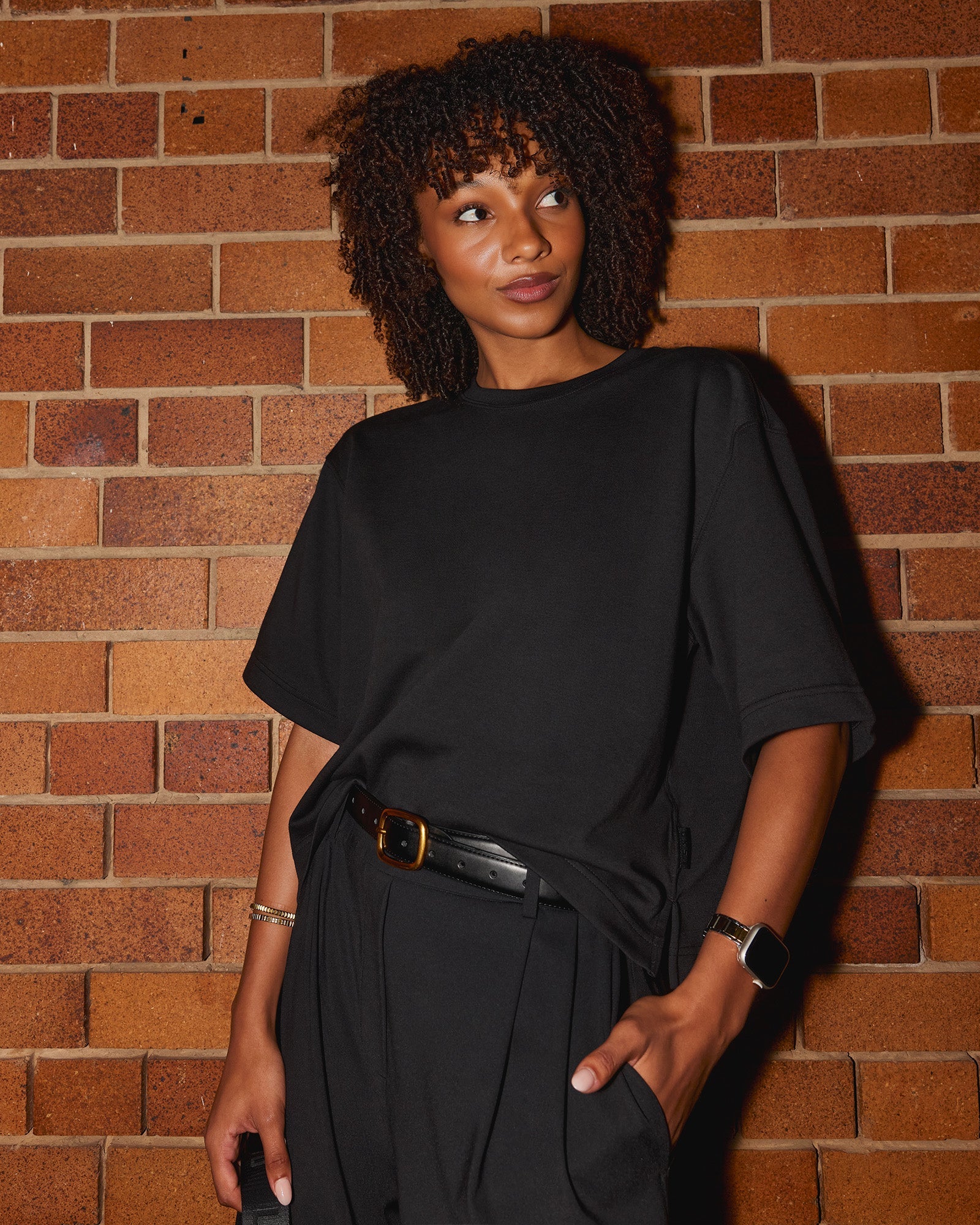 Woman wearing AfterDark ZeroCrease Cropped Tee - Black | Model:Tomi | Size:S