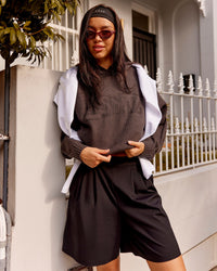 Woman wearing All Day Active Knitted Hoodie - Dark Storm | Model:Kaye | Size:S | Thumbnail Index: 1