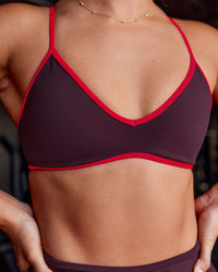 Woman wearing Ambience Sports Bra - Cherry Lacquer-Flame | Model:Iris | Size:S | Thumbnail Index: 1