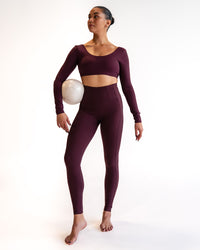 Woman wearing Aria Long Sleeve Sports Bra - Cherry Lacquer | Model:Sarah | Size:S | Thumbnail Index: 2