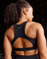 Woman wearing Ascent Sports Bra - Black | Model:Tarnie | Size:S | Thumbnail Index: 1