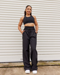Woman wearing Ascent Sports Bra - Black | Model:Tarnie | Size:S | Thumbnail Index: 2