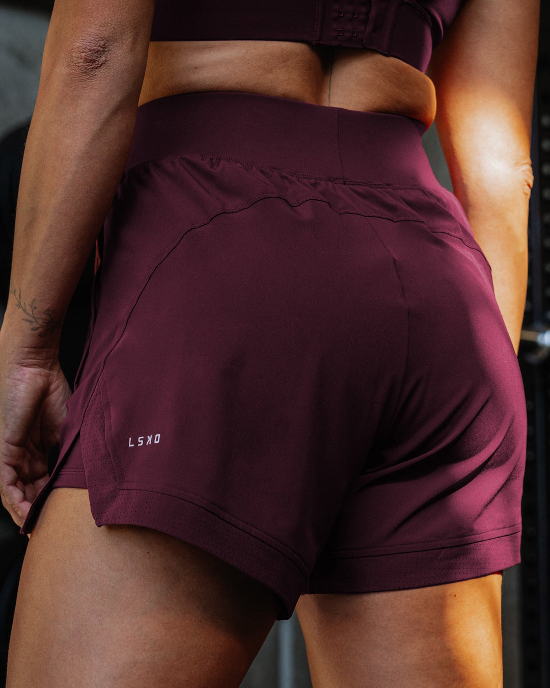 Woman wearing Challenger 5&quot; Lined Performance Short - Cherry Lacquer | Model:Sammy | Size:S
