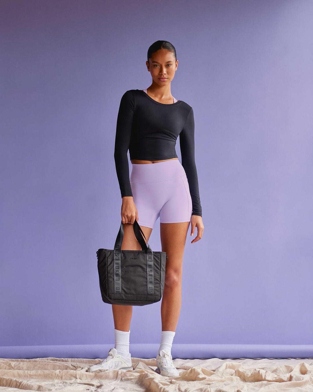 Woman wearing Effortless Long Sleeve Top - Black | Model:Tali | Size:S