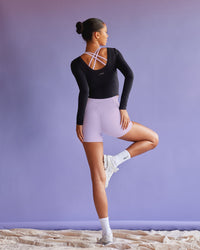 Woman wearing Effortless Long Sleeve Top - Black | Model:Tali | Size:S | Thumbnail Index: 0