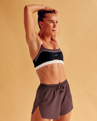 Man wearing Elevate Sports Bra - Black-Multi | Model:Charlize | Size:S