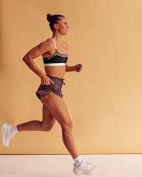 Man wearing Elevate Sports Bra - Black-Multi | Model:Charlize | Size:S | Thumbnail Index: 2