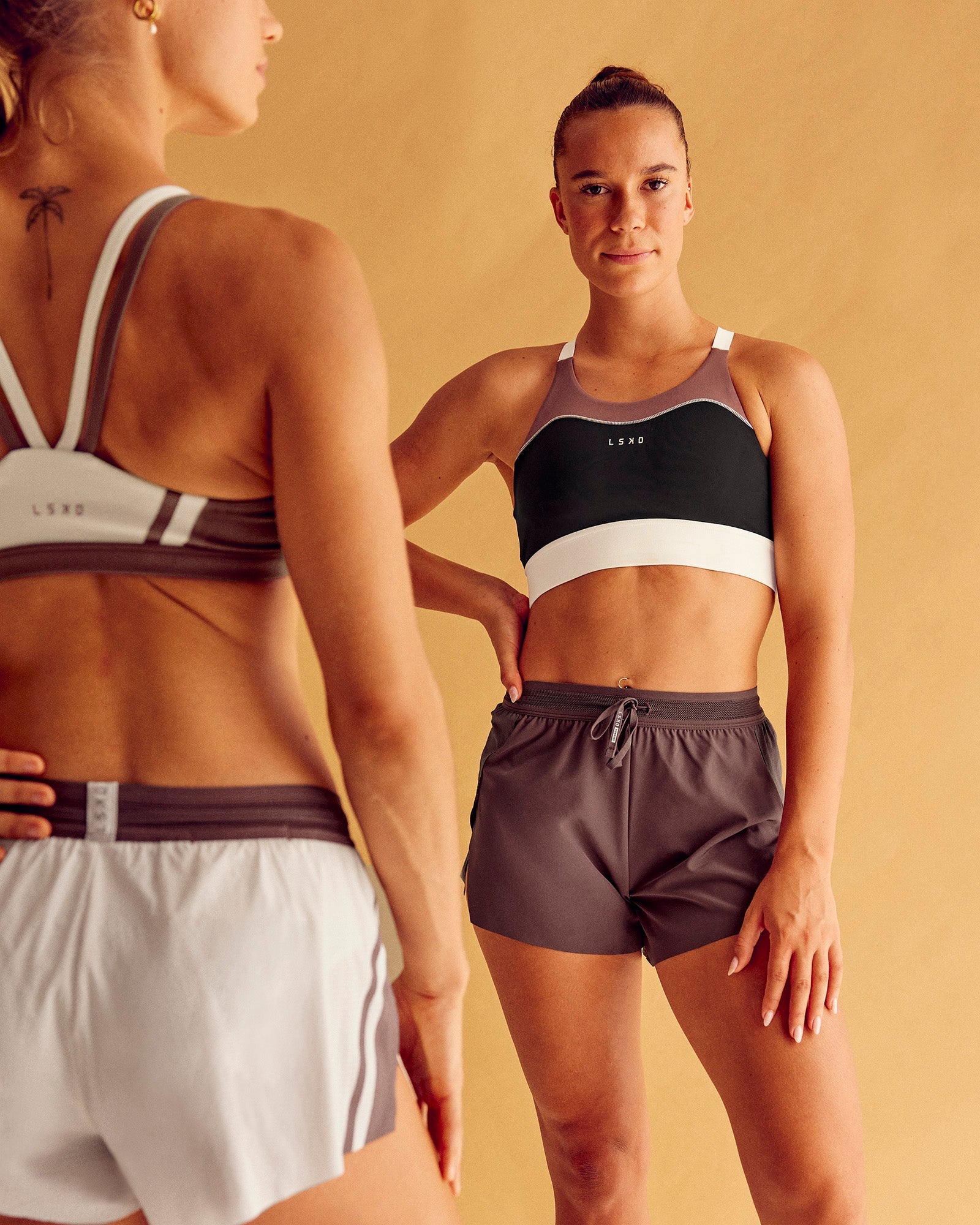 Woman wearing Elevated Accelerate Sports Bra - Black-Multi | Model:Charlize | Size:S