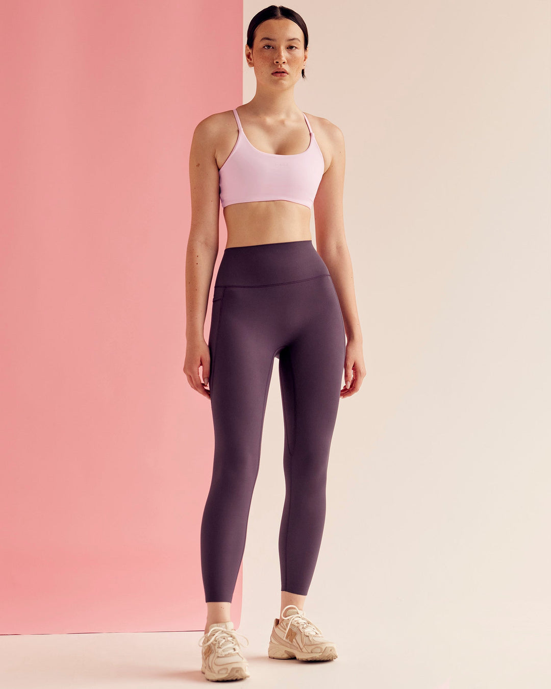 Woman wearing Elixir Ultra High-Rise 7/8 Legging Pockets - Midnight Plum | Model:Paradise | Size:S