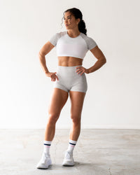 Woman wearing Enhance Ultra High-Rise 4" Short - Grey Marl | Model:Emily | Size:S