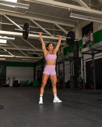 Woman wearing Enhance Ultra High-Rise 4" Short - Pink Frosting | Model:Emily | Size:S