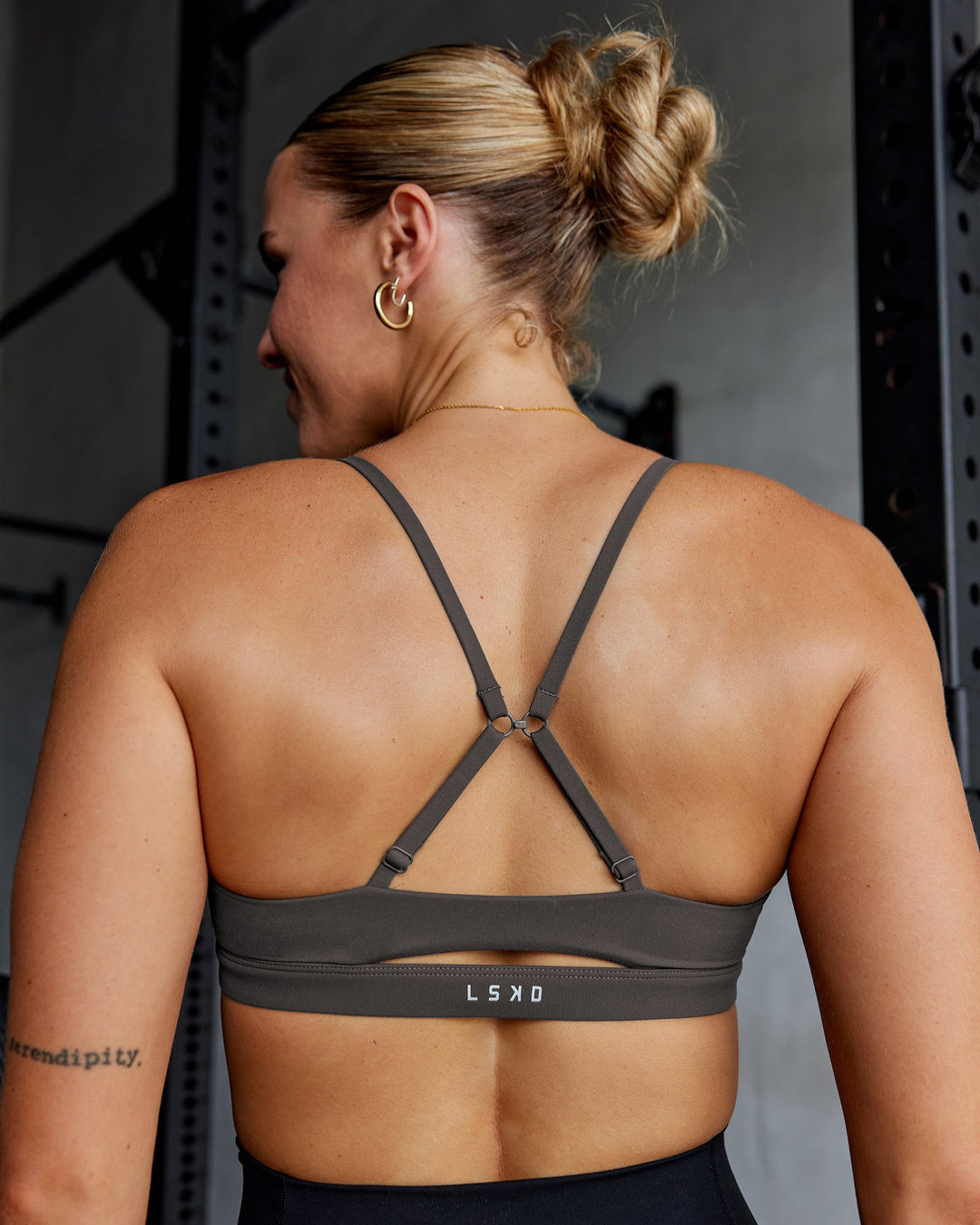 Woman wearing Essence Sports Bra - Dark Storm | Model:Shae | Size:S