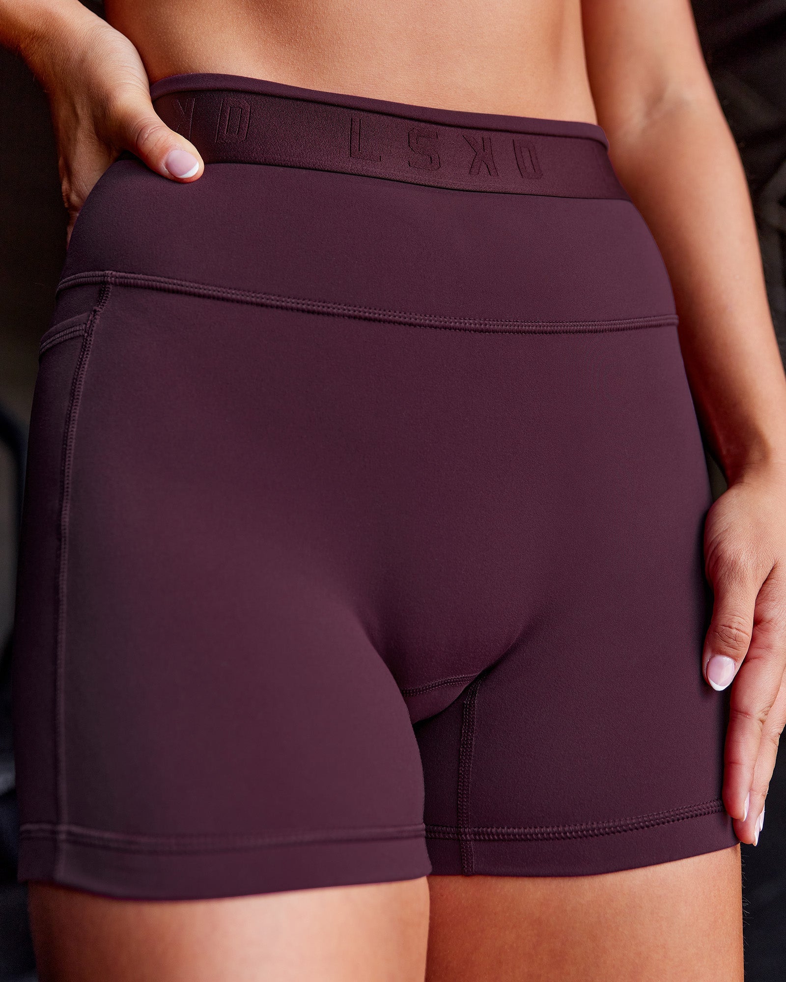 Woman wearing Fusion Jacquard High-Rise 4” Short Pockets - Cherry Lacquer | Model:Iris | Size:S