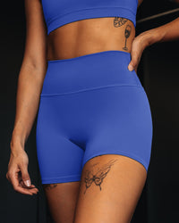 Woman wearing Fusion Ultra High-Rise 4" Short - Power Cobalt | Model:Vanessa | Size:S