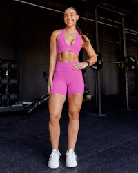 Woman wearing Fusion Ultra High-Rise 6" Short Pockets - Ultra Fuchsia | Model:Summer | Size:S