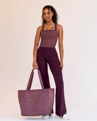 Woman wearing Fusion V-Contour High-Rise Flared Legging Pockets - Cherry Lacquer | Model:Jordan | Size:S | Thumbnail Index: 2