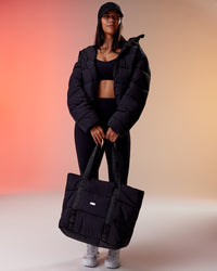 Woman wearing Go-To Puffer Jacket - Black | Model:Rhiley | Size:S
