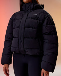 Woman wearing Go-To Puffer Jacket - Black | Model:Rhiley | Size:S