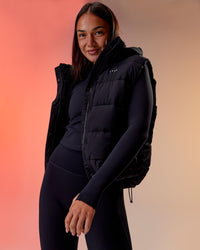 Woman wearing Go-To Puffer Vest - Black | Model:Kirstyn | Size:S