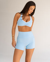 Woman wearing Luminous Sports Bra - Open Air-White | Model:Bianca | Size:S