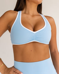 Woman wearing Luminous Sports Bra - Open Air-White | Model:Bianca | Size:S