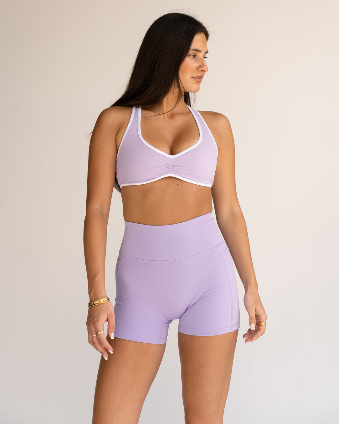 Woman wearing Luminous Sports Bra - Pale Lilac-White | Model:Jordi | Size:S