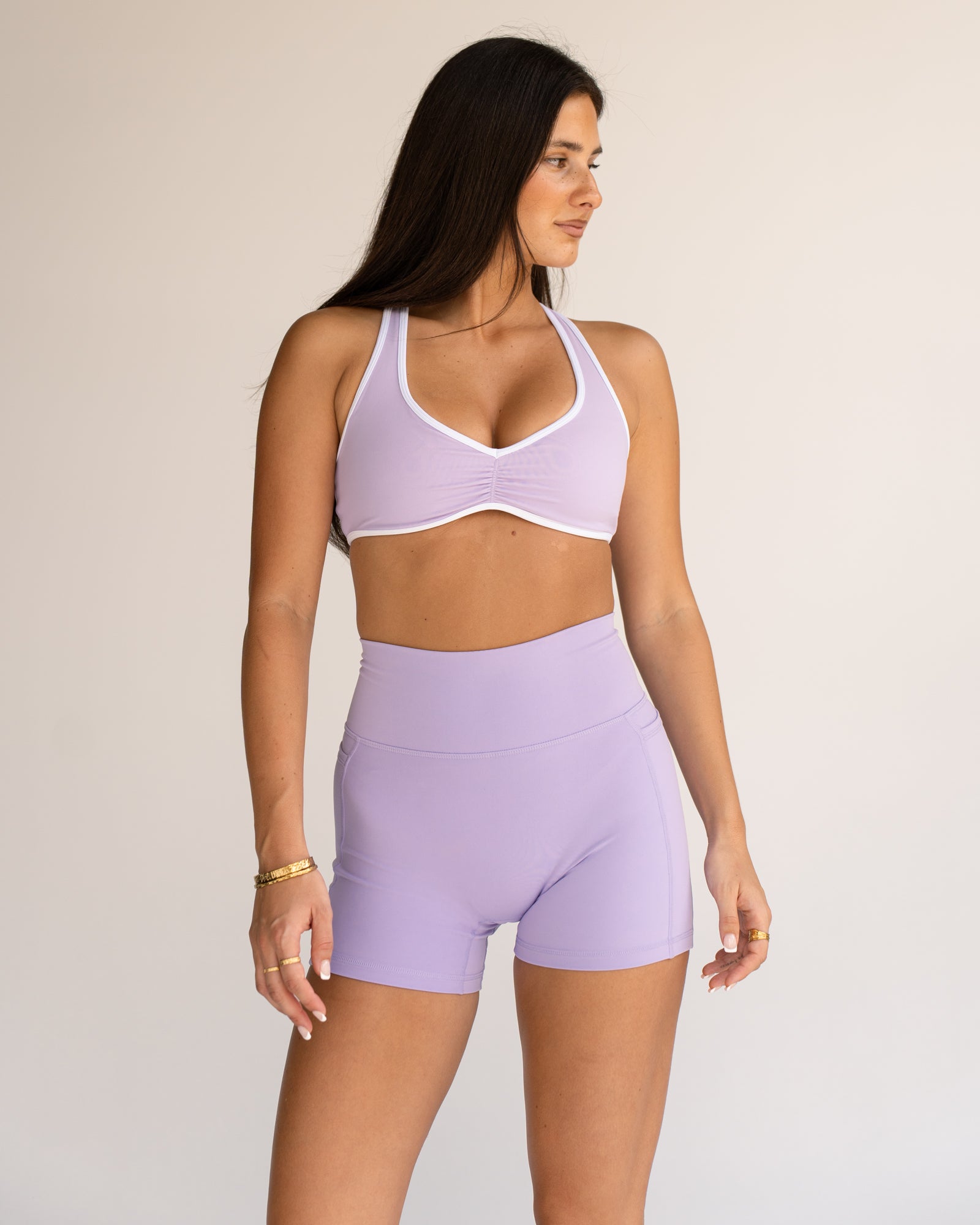 Woman wearing Luminous Sports Bra - Pale Lilac-White | Model:Jordi | Size:S