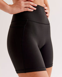 Woman wearing O.G Fusion Ultra High-Rise 6" Short Pockets - Black | Model:Ysabella | Size:S