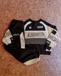 Woman wearing Power Play Stitch Up Fleece Sweat Pant - Black-Shale Beige