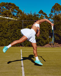 Woman wearing Precision Active Skirt - White | Model:Laquisa | Size:S | Thumbnail Index: 0