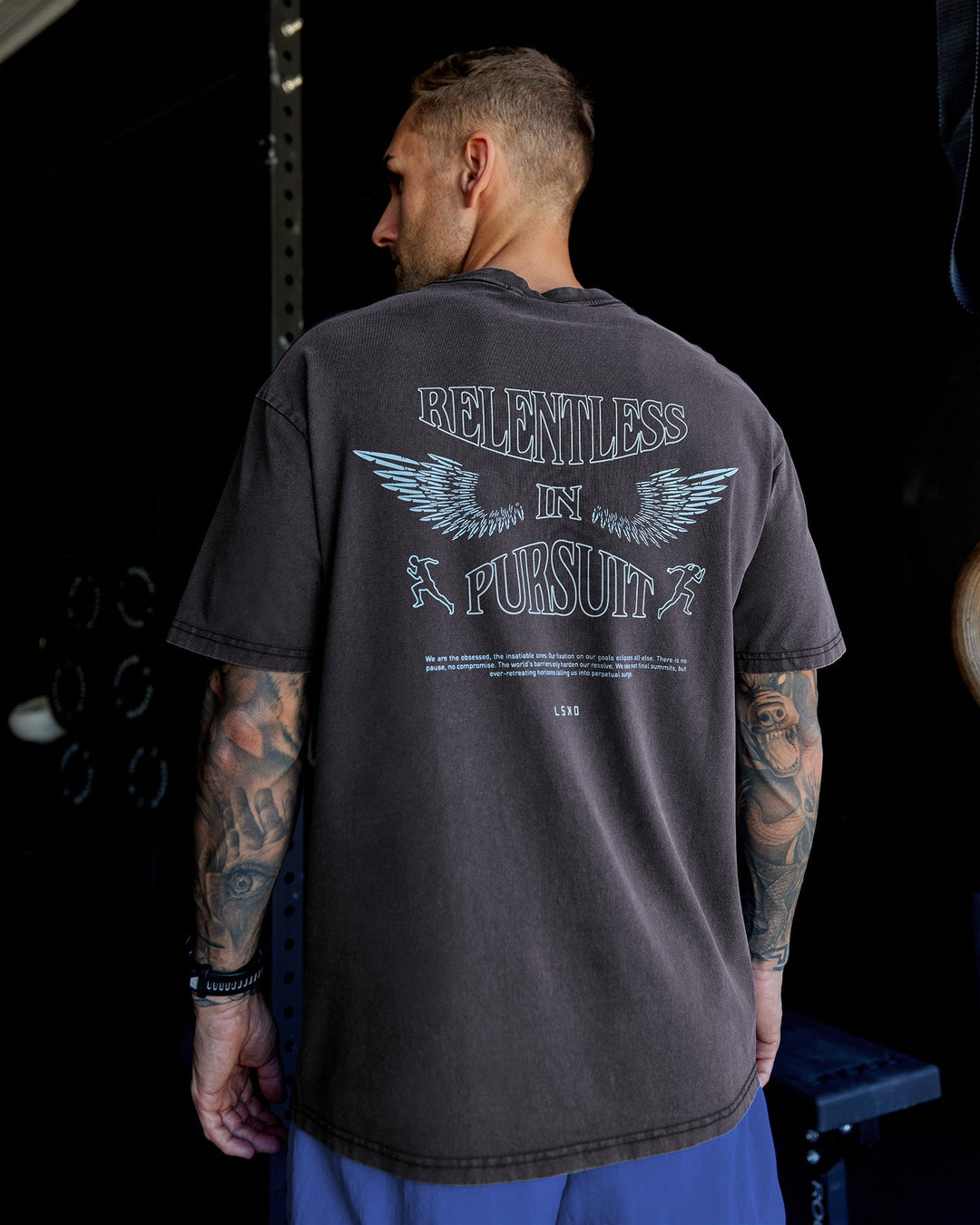 Man wearing Relentless Washed FLXCotton Oversized Tee - Black-Ultimate Grey | Model:Tommy | Size:S