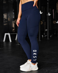 Woman wearing Rep Ultra High-Rise Full Length Legging Pockets - Future Navy-White | Model:Ella | Size:S