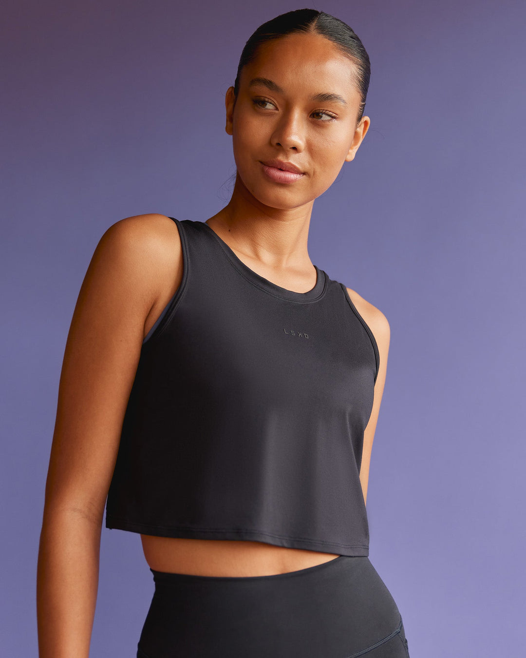 Woman wearing Restore CloudFLX Tank - Black | Model:Tali | Size:S