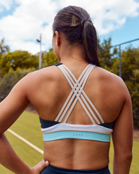 Woman wearing Revitalise Flash Sports Bra - Future Navy-Multi | Model:Lizette | Size:S