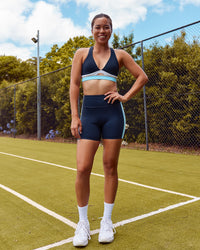 Woman wearing Revitalise Ultra High-Rise 6" Short - Future Navy-Multi | Model:Lizette | Size:S