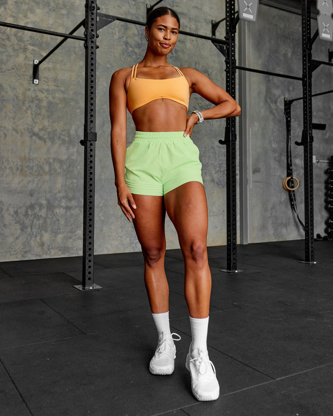Woman wearing Sport Short 2.5&quot; - Solar Lime | Model:Janet | Size:S