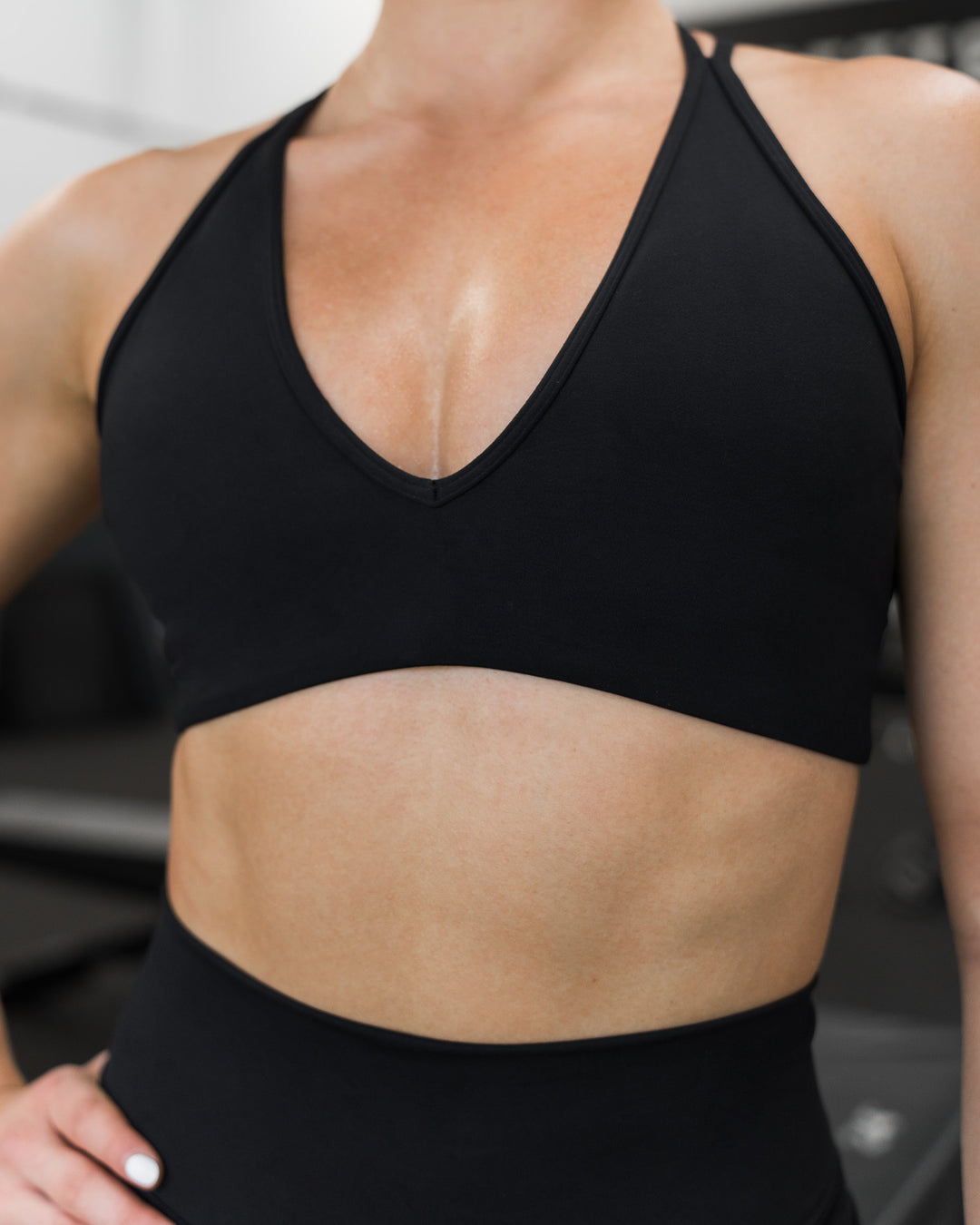 Woman wearing Stamina Pulse Sports Bra - Black | Model:Sarah | Size:S