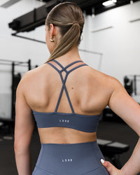 Woman wearing Stamina Pulse Sports Bra - Night Shadow | Model:Sarah | Size:S | Thumbnail Index: 11